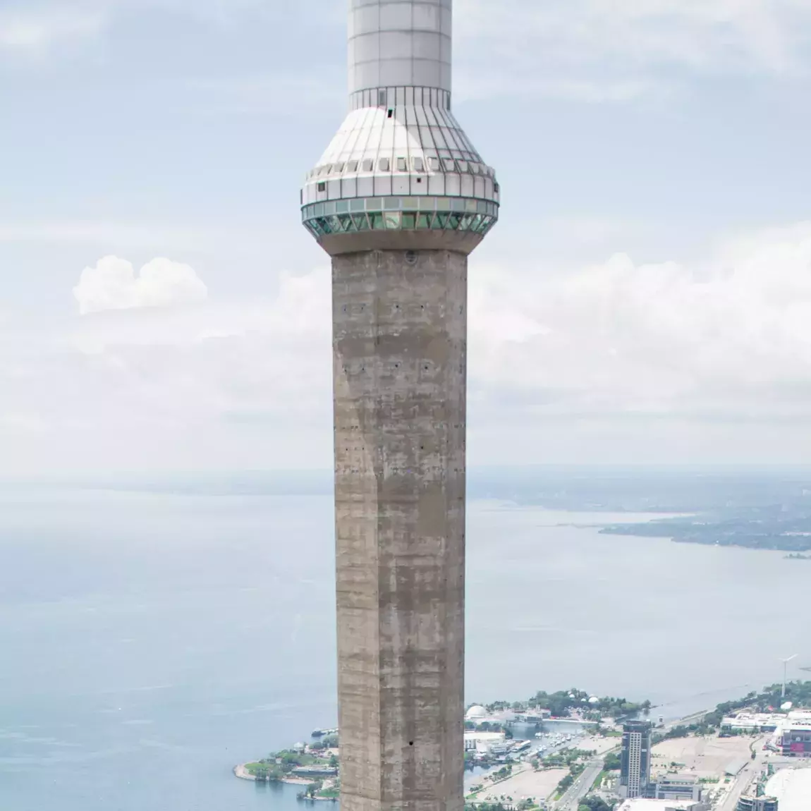 Skypod section of the tower taken at eye level. Toronto below and clouds in the background.