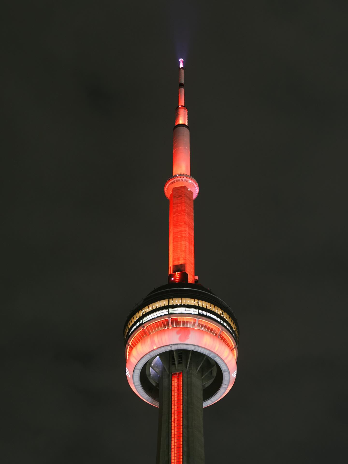 CN Tower lit in red at night